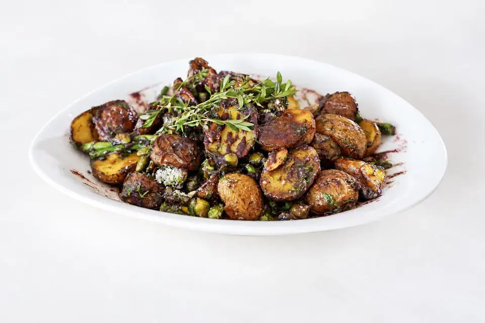 Roasted baby potatoes and asparagus with blueberry lavender dressing and grated cheese