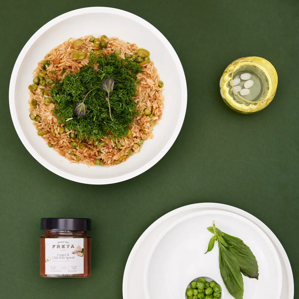 Ginger-spiced pear rice with peas, fava beans, and a generous herb garnish