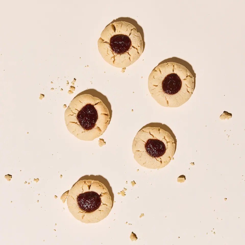 Strawberry jalapeño thumbprint cookies with dark red fruit centers
