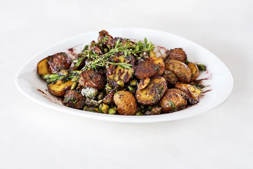 Roasted baby potatoes and asparagus with blueberry lavender dressing and herbs